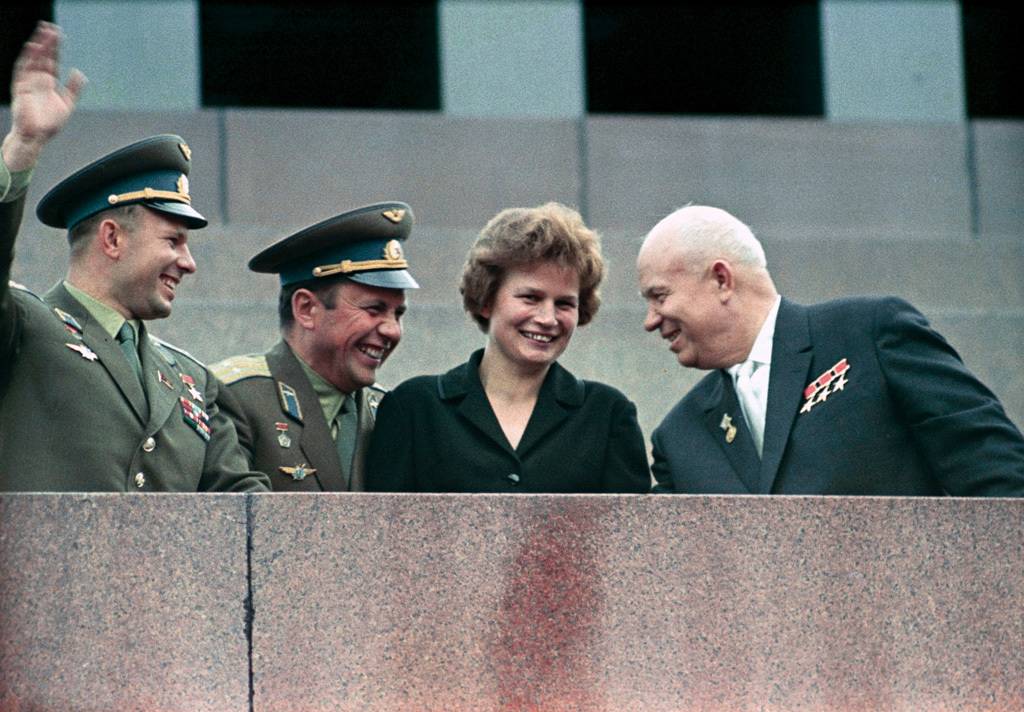“Nikita Khrushchev, Valentina Tereshkova, Pavel Popovich and Yury Gagarin at Lenin Mausoleum”. Nikita Khrushchev (right), first secretary of the CPSU Central Committee, and cosmonauts Valentina Tereshkova, Pavel Popovich (center) and Yuri Gagarin at the Lenin Mausoleum during a demonstration dedicated to the successful space flights of the Vostok-5 (Valery Bykovsky) and Vostok-6 (Valentina Tershkova) spacecraft. [See #67477]