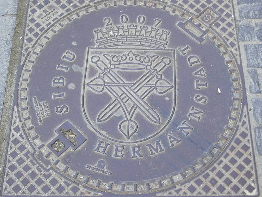 Bilingual sewer lid in Hermannstadt / Sibiu, Romania.